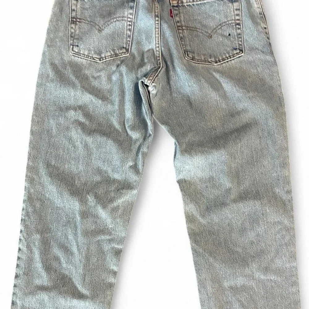 Vintage/Y2K 1999 Levi's 550 relaxed fit/tapered leg light wash 100% rigid cotton
